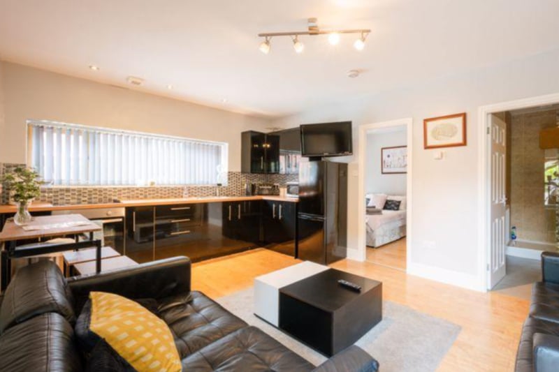 The annex has a spacious living area, with a modern fitted kitchen. 