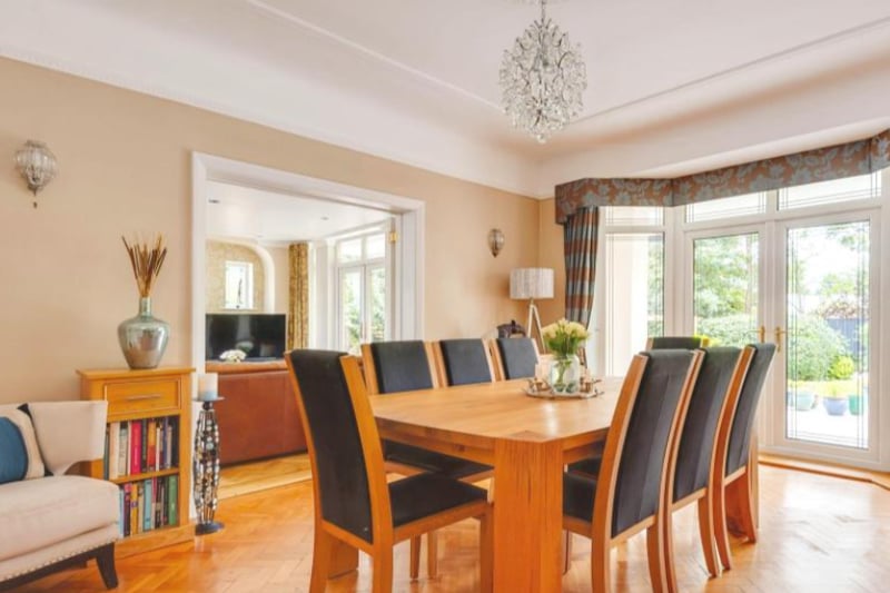 A separate dining room is perfect for hosting, with wonderful views of the garden.