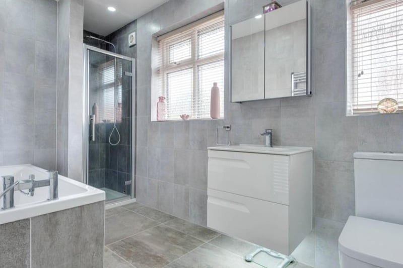 The master bedroom’s en-suite has a bath and a shower, and is finished beautifully.