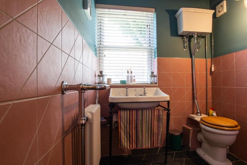 The downstairs bathroom feels luxurious, as if you’re in a quirky restaurant bathroom.