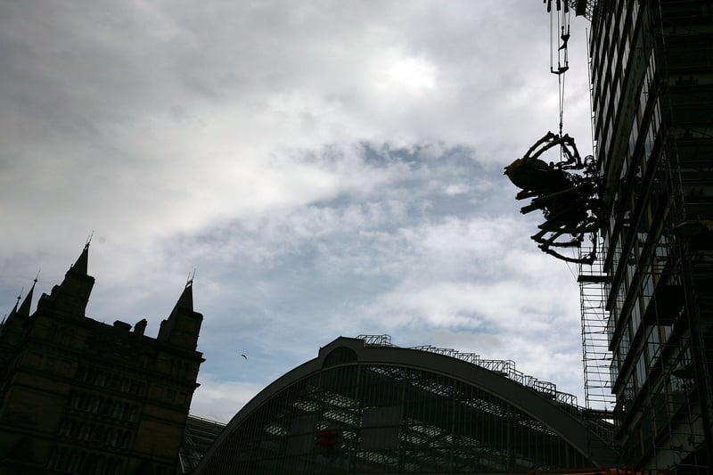   A giant mechanical spider sits on the side of the derelict Concourse tower in Liverpool city centre on on September 3, 2008. 