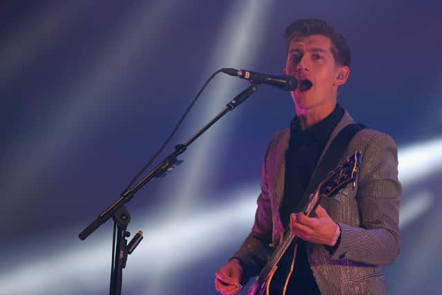 Arctic Monkeys lead singer Alex Turner performs on the Pyramid Stage at the Glastonbury Festival in 2013 (Getty Images)