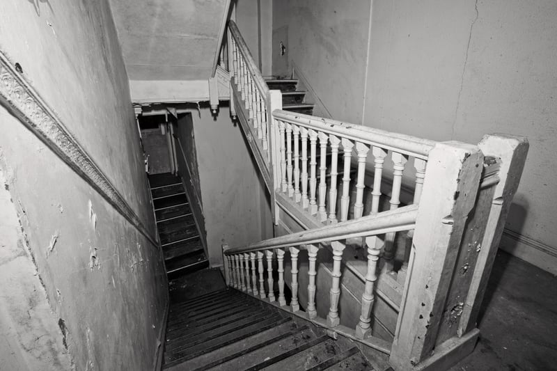 A dilapidated stairway inside the hotel. Date of picture unknown.