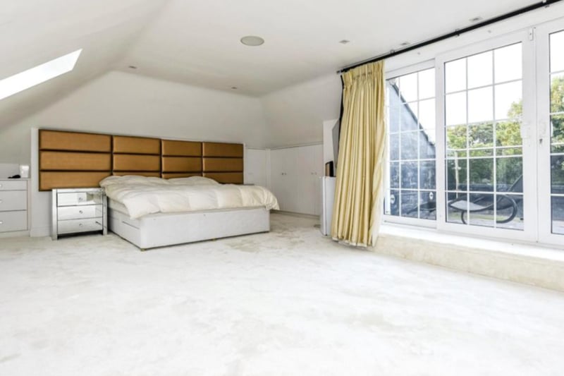 The third floor features the spacious master bedroom, complete with a stunning balcony.