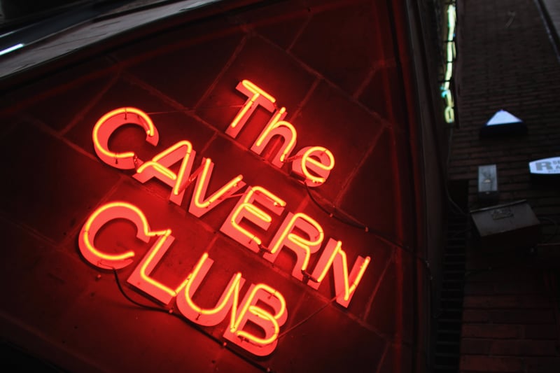 A neon sign illuminates the entrance of the famous Cavern Club on the 50th anniversary of the first time The Beatles played at the basement club.