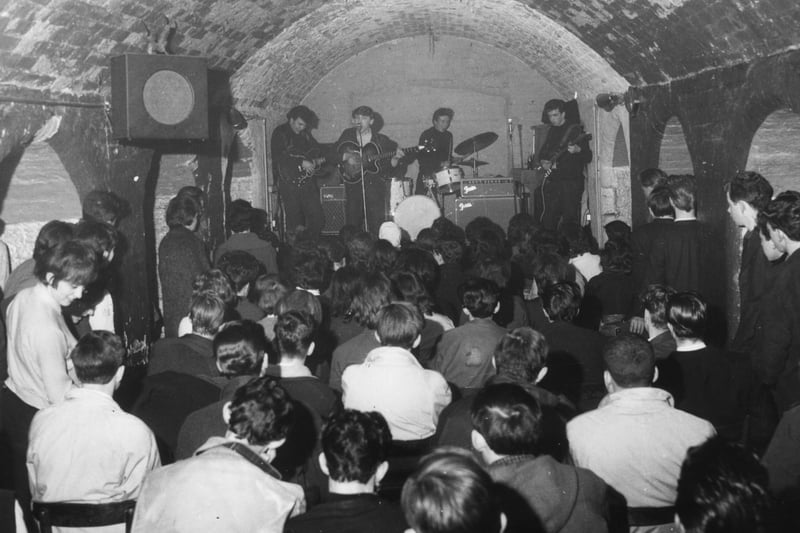 A packed crowd watching the Merseybeats play.