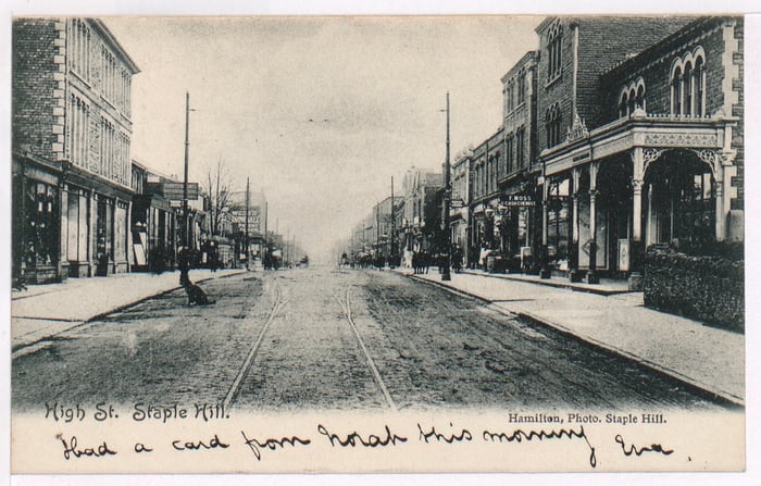 Staple Hill High Street in the early 1900s. F. Moss chemists can be seen on the right, the building is now used as a DIY store.