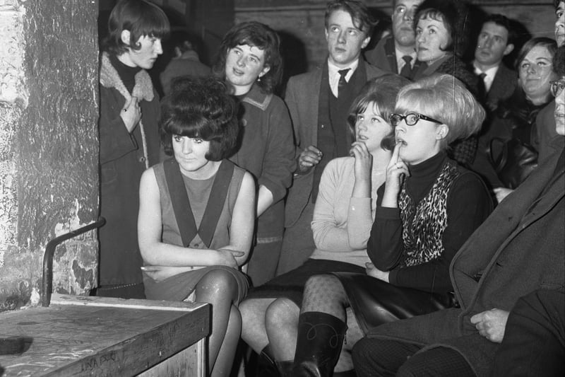 A crowd of young people watching the latest act at the Cavern Club in 1964.