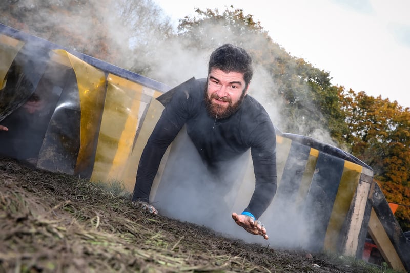 This obstacle is called Cry Baby and involves crawling through a smoky chamber. Credit: Tough Mudder
