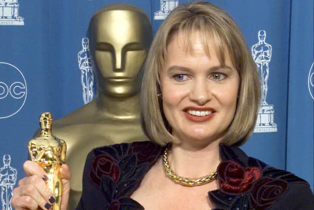 Anne Dudley, winner for Best Original Musical or Comedy Score for "The Full Monty", poses for photographers with the Oscar 23 March at the 70th Annual Academy Awards at the Shrine Auditorium in Los Angeles.   (ELECTRONIC IMAGE)    AFP PHOTO/Hector MATA (Photo credit should read HECTOR MATA/AFP via Getty Images)