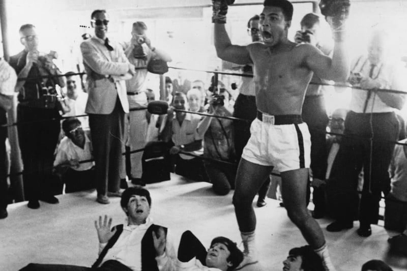 This iconic photograph was taken when The Beatles met Muhammad Ali, who was still known as Cassius Clay, in February 1964. 
