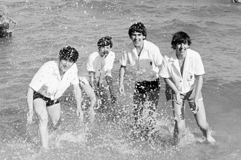 Following their debut performance in the U.S, the fab four hit the beach in Miami to get some downtime but were later mobbed by fans. This photo, taken in February 1964, shows them playing in the sea.