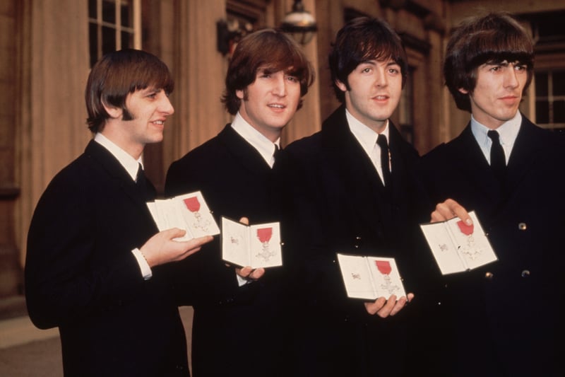26th October 1965:  Ringo Starr, John Lennon, Paul McCartney and George Harrison outside Buckingham Palace, London, after receiving their MBE’s from the Queen. 