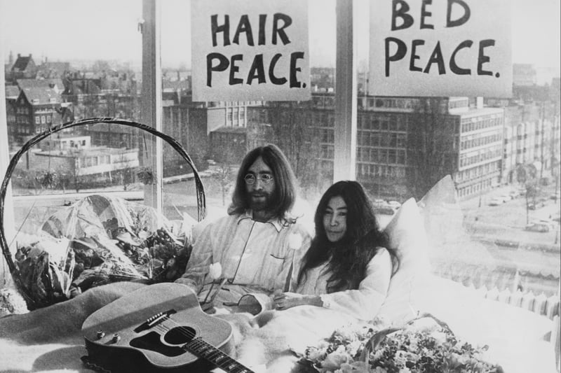 Beatle John Lennon and his wife Yoko Ono in their bed in the Presidential Suite of the Hilton Hotel, Amsterdam, 25th March 1969. The couple staged a ‘bed-in for peace’ as a protest against war and violence in the world.