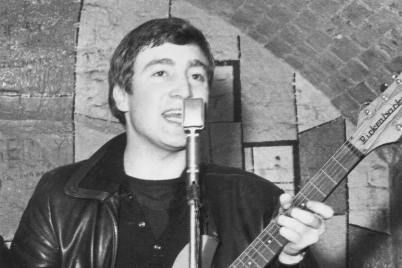 John Lennon live on stage at the Cavern Club in Matthew Street, Liverpool.  Image: Evening Standard/Hulton Archive/Getty Images