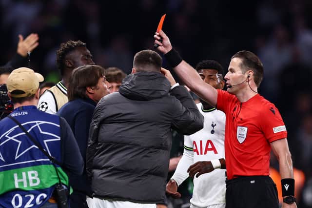 Match referee, Danny Makkelie shows Antonio Conte, Manager of Tottenham Hotspur  (Photo by Clive Rose/Getty Images)