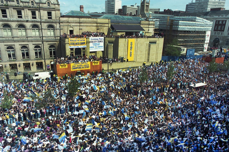 The Headrow is packed with Whites fans as Leeds United parade the First Division trophy from the Art Gallery.