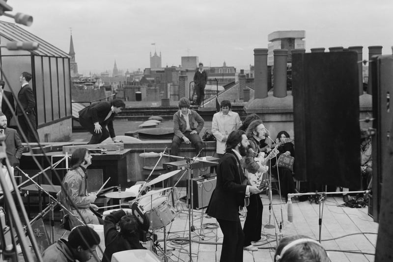 The Beatles performing their last live public concert on the rooftop of the Apple Organization building on 30th January 1969. Image: Evening Standard/Hulton Archive/Getty Images