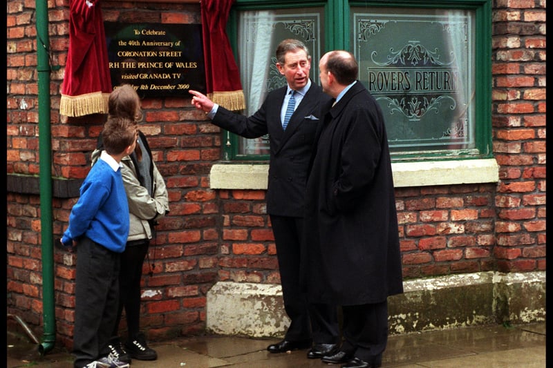 King Charles unveiling an unveils an anniversary plaque at the Rovers Return on the set of Coronation Street in 2000. (Photo by Daniel Callister/Newsmakers)
