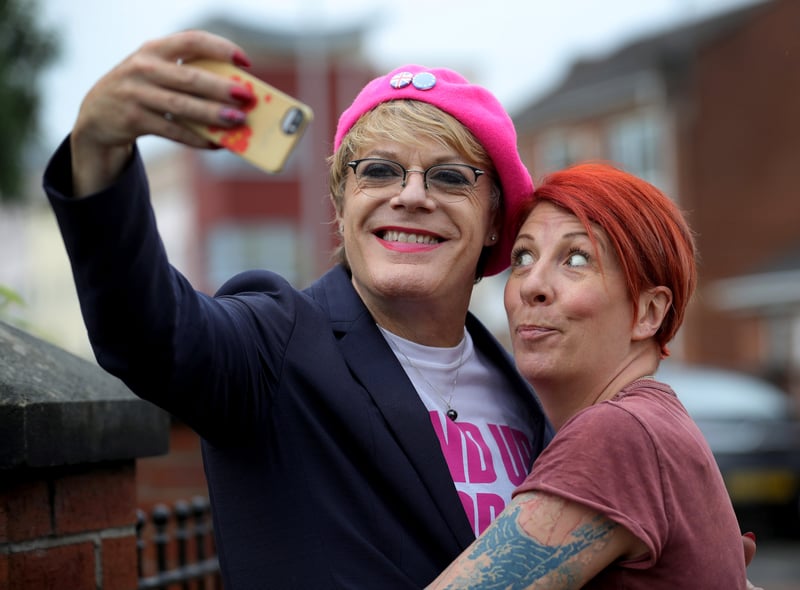 Comedian and actor Eddie Izzard poses with a fan in Hulme while campaigning to remain in the EU with Labour activists ahead of the Brexit referendum  in 2016.  (Photo by Christopher Furlong/Getty Images)