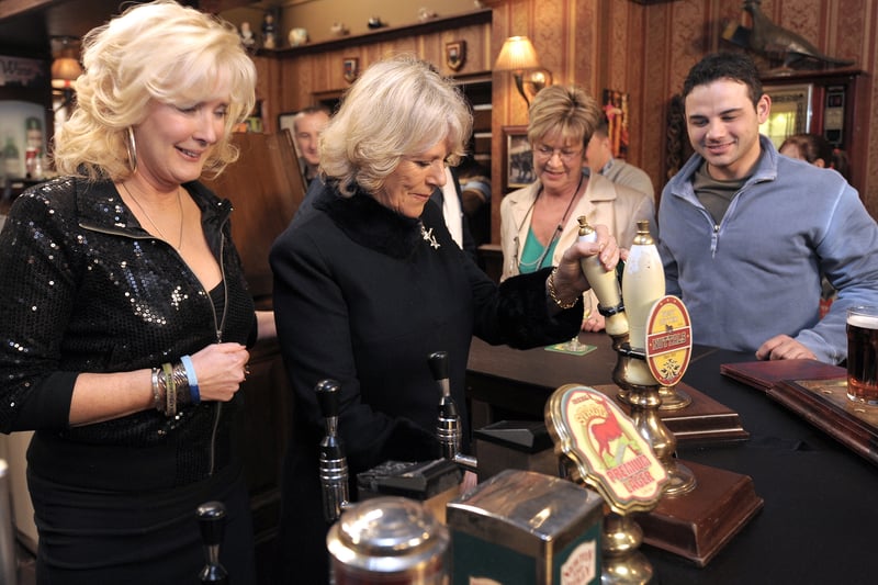 The Duchess of Cornwall pulling a pint at the Rovers Return on the set of Coronation Street in 2010 (Photo: ANDREW YATES/AFP via Getty Images)