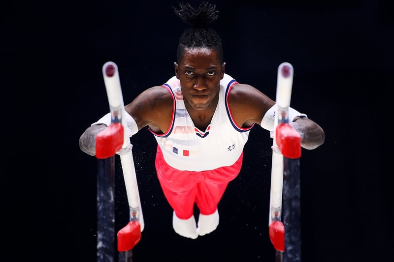 Cameron-Lie Bernard of Team France competes on Parallel Bars. (Photo by Laurence Griffiths/Getty Images)