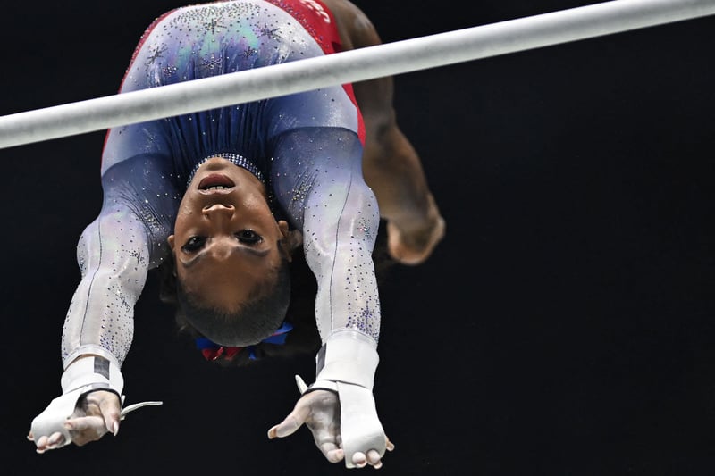 USA’s Shilese Jones competes during the Women’s Uneven Bars team final event. (Photo by BEN STANSALL/AFP via Getty Images)