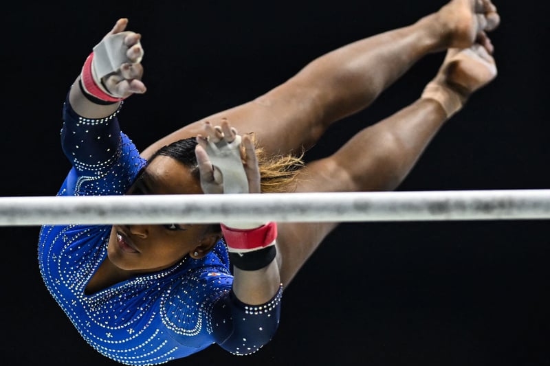Brazil’s Rebecca Andrade competes during the Women’s Uneven Bars team final event. (Photo by BEN STANSALL/AFP via Getty Images)