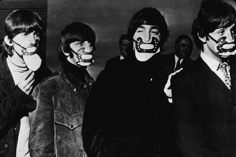  The Beatles wearing fog masks before a concert in Manchester in 1965.  (Photo by Express Newspapers/Getty Images)
