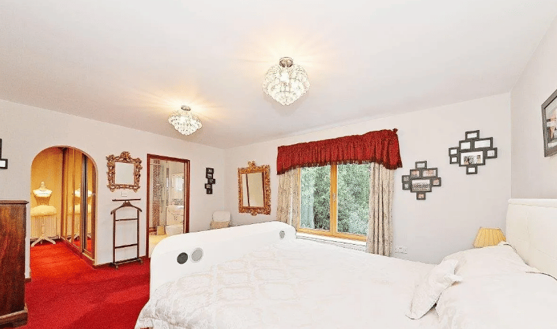 The master bedroom with a walkin closet and a view of the rear garden. It is on the first floor of the house (Credit - Zoopla)