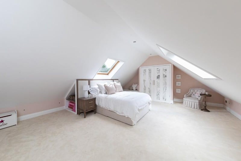 All the bedrooms have ample space, check out the skylight windows in this one.
