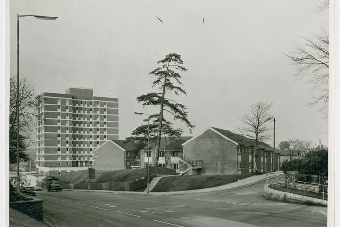 The photo looks down Brislington Hill. The turning on the right is Glenarm Road. During the 1960s, the council acquired two large properties on the north-east side of the road which were to be redeveloped for social housing. These would become Brislington Hill House, an 18th century mansion which had been derelict since WW2, and the Shrubbery nurseries further down the hill. The area was radically redeveloped by 1970 which can be seen in this picture. The two-storey development is Merryweathers, a block of flats for elderly residents,  and Gilton House, also built for older tenants.