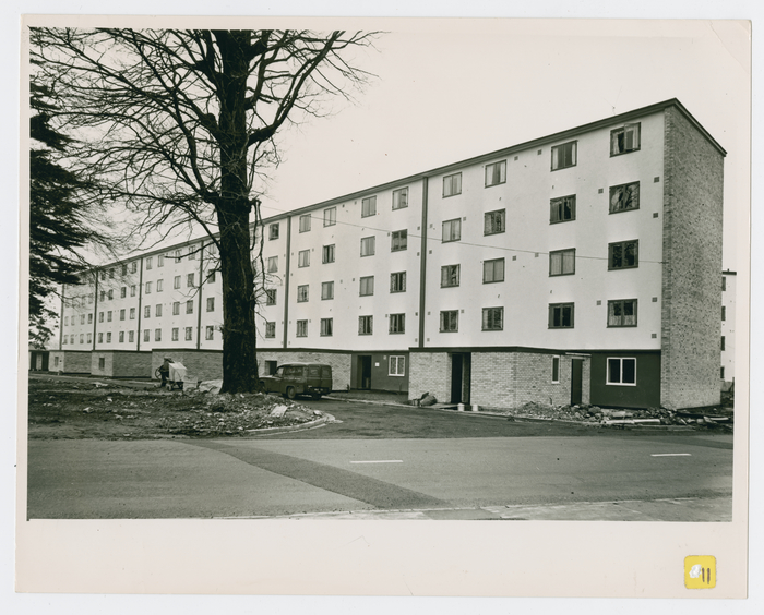 This image shows the largest block at Henbury Court, shortly after completion in 1957. The building contained 30 flats on five floors. It was built on the site of the former Henbury Court Hotel. The finishing touches can be seen still being made to the flats despite residents already moving into the building. The small utility blocks seen have since been removed.