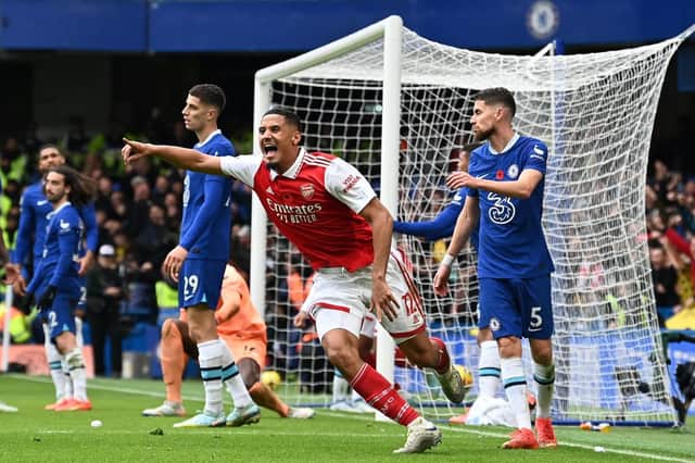 Arsenal's French defender William Saliba (C) celebrates after Arsenal's Brazilian defender Gabriel Magalhaes (Photo by GLYN KIRK/AFP via Getty Images)