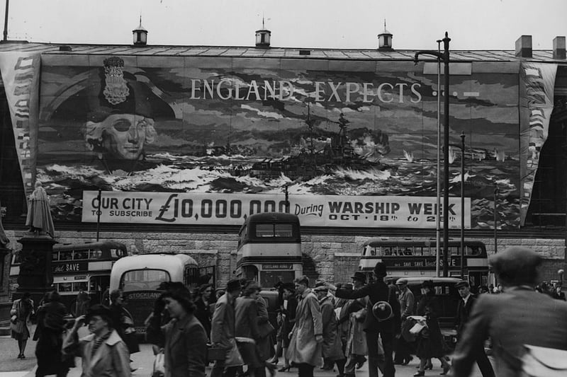 A huge poster, considered to be the largest in the world at the time, covering one side of Birmingham Town Hall, asking the city to raise 10,000,000 pounds during Warship Week in order to ‘adopt’ a battleship.