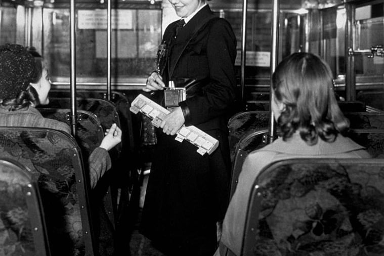   A conductress collecting fares during her first run, following the introduction of war time duty in Birmingham.  (Photo by Topical Press Agency/Getty Images)