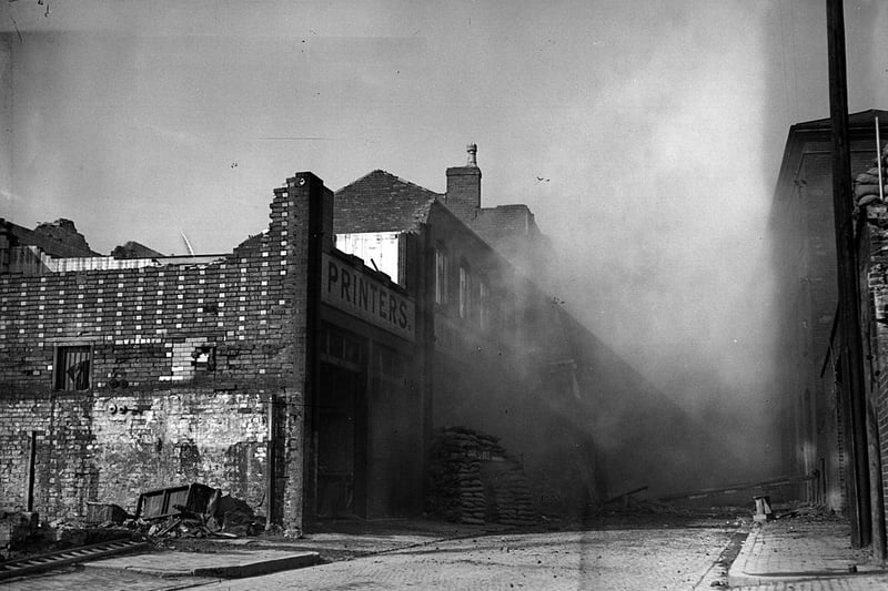 Air Raid Precaution officials blow up a house in Birmingham to test the effectiveness of strengthened cellars.  (Photo by Hampton/London Express/Getty Images)