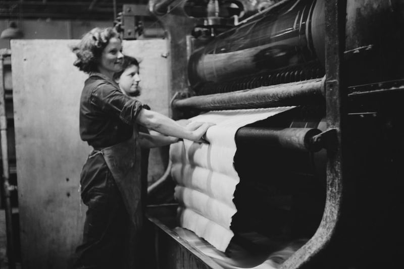 Women working in a factory in Birmingham, England, during World War II, August 1941. From a Ministry of Information special on Birmingham. (Photo by Fred Ramage/Keystone Features/Hulton Archive/Getty Images)