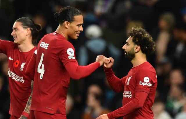 Virgil van Dijk celebrates with Mo Salah following Liverpool’s second goal against Tottenham. Picture: Andrew Powell/Liverpool FC via Getty Images