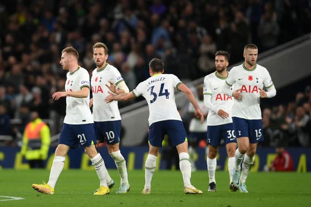 Harry Kane of Tottenham Hotspur celebrates with teammates after scoring their team's first goal  during the Premier League . (Photo by Mike Hewitt/Getty Images)