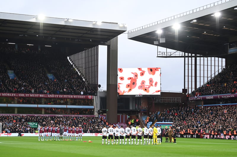 The two teams line up at the centre circle to observe a minute’s silence ahead of Remembrance Day.