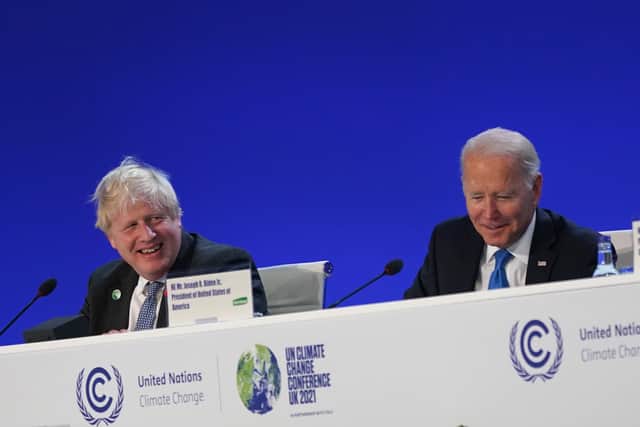 Britain’s then Prime Minister Boris Johnson and U.S. President Joe Biden attend the World Leaders’ Summit “Accelerating Clean Technology Innovation and Deployment” session on day three of COP26 on November 02, 2021.