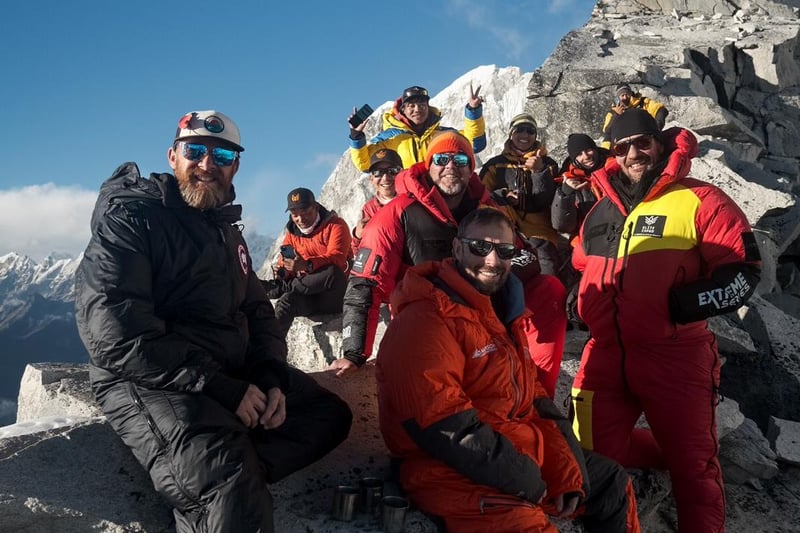 The expedition team, including Aldo Kane, far left, and Ollie Ollerton, far right, remained in good spirits throughout their climb.