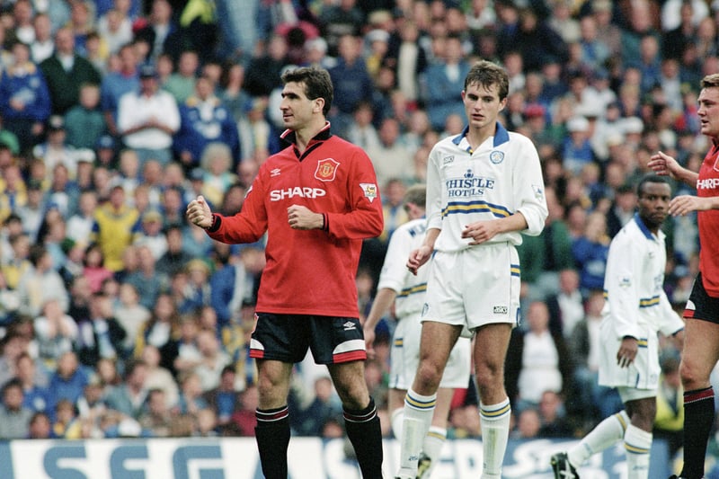 Former teammates Eric Cantona and David Wetherall face off at Elland Road as reigning champions Manchester United claim a 2-0 win in April 1994.