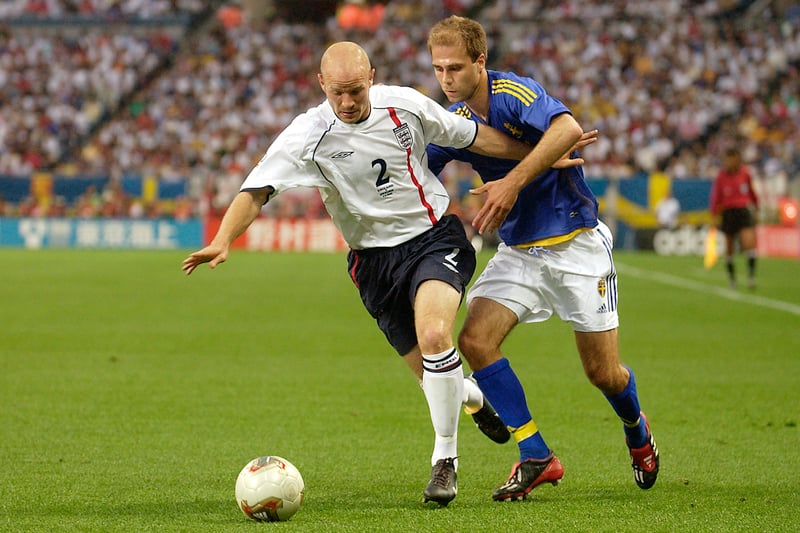 Danny Mills holds off Teddy Lucic during the Three Lions’ 1-1 Group F draw with Sweden at the Saitama Stadium in Japan.