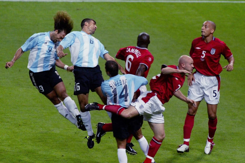 Danny Mills and Rio Ferdinand combine to face an aerial attack by Argentina in the Three Lions’ Group F win.