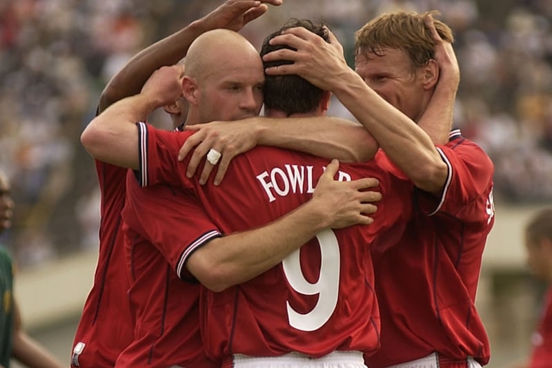 Danny Mills congratulates his Leeds United team-mate Robbie Fowler after the forward bagged an injury-time equaliser in England’s warm-up match against Cameroon in Kobe, Japan.
