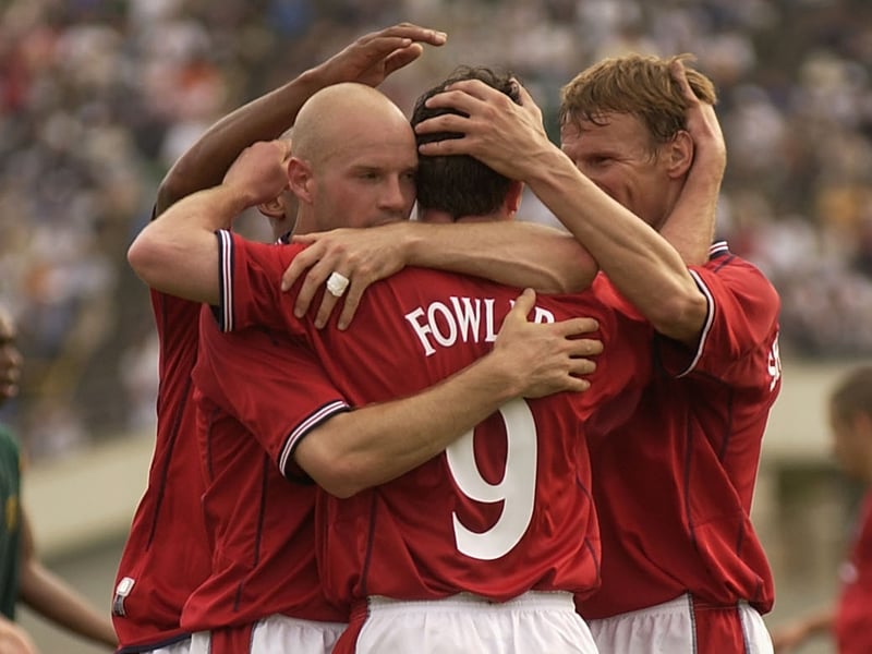 Danny Mills congratulates his Leeds United team-mate Robbie Fowler after the forward bagged an injury-time equaliser in England’s warm-up match against Cameroon in Kobe, Japan.