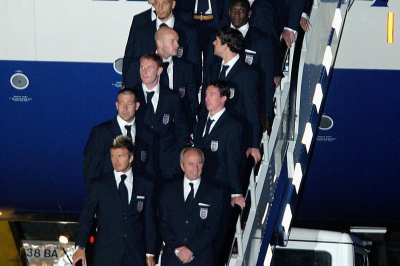 At Heathrow, the England team arrive home from Japan after exiting the World Cup at the quarter-final stage.