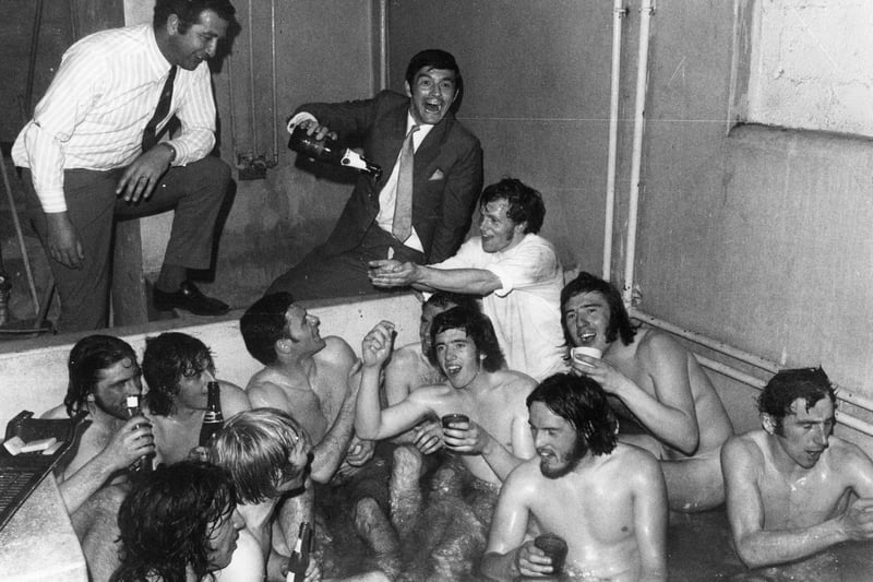 1965:  The Birmingham City team celebrate a win with champagne in the bath